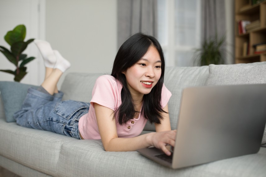 Young Asian Lady Girl Chinese Laptop Web Design Sofa Remote WFH