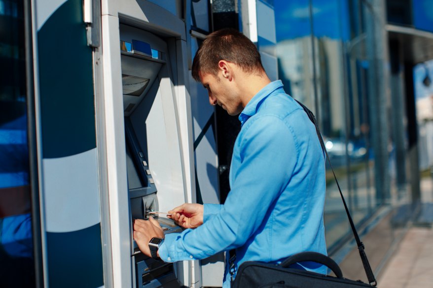 Young Businessman Withdrawing Money ATM Ouside