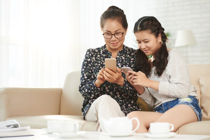 Asian Mom Daughter Using Mobile Phone App User Taking Photo