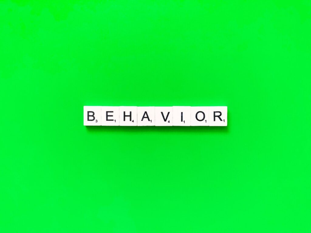 Behavior concept on green background