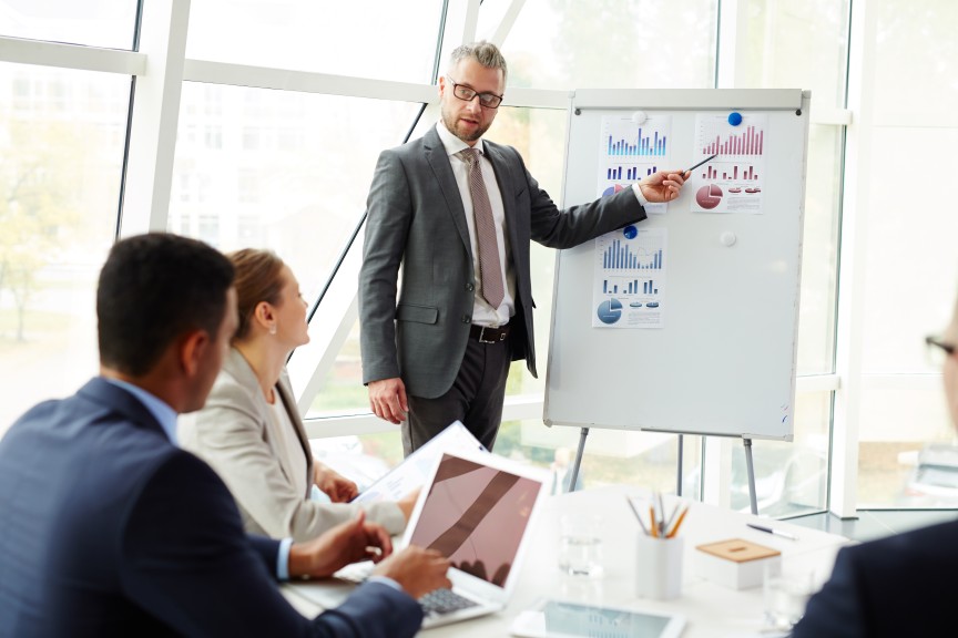 Changing Target Market Audience Whiteboard Businessman Showing Graphs