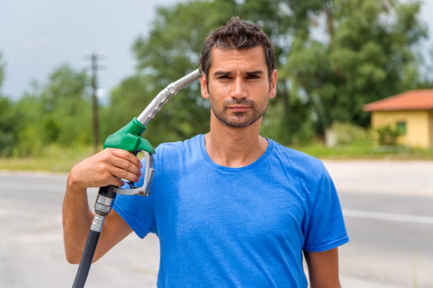 High Fuel Price Man Holding Pump Like a Gun Inflation