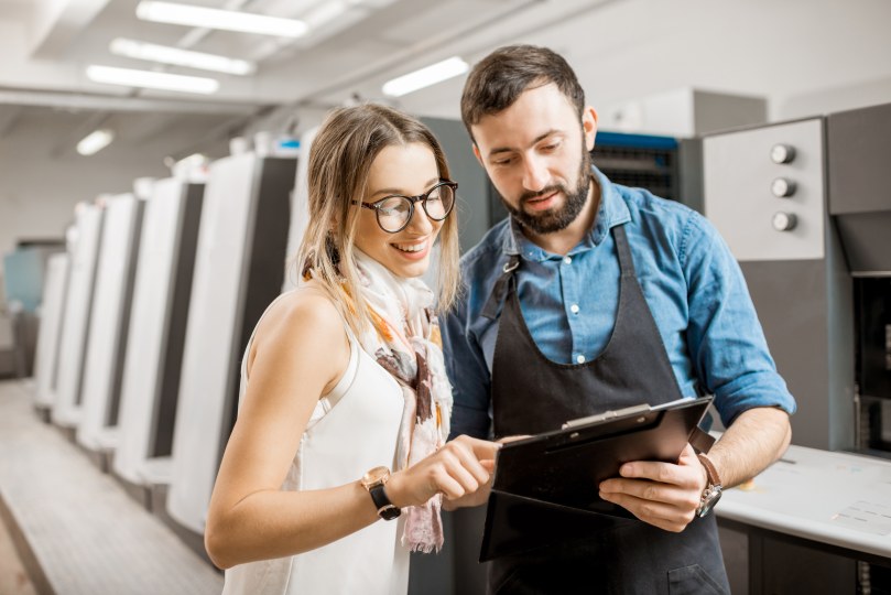 Smiling Woman with Male Operator Manufacturing Factory