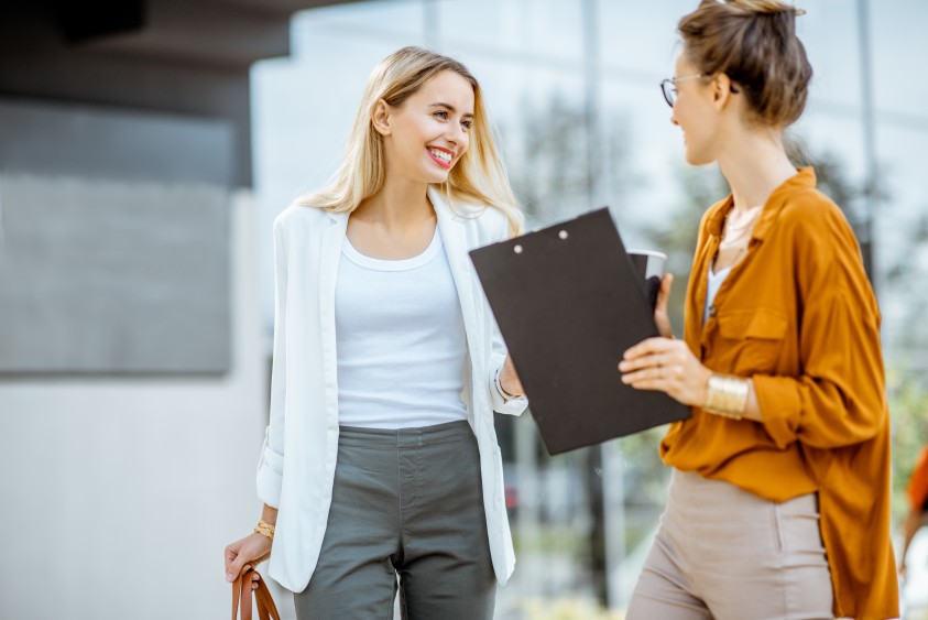 Two Business Women Females Building Relationship Happy Smiling Speaking Communication