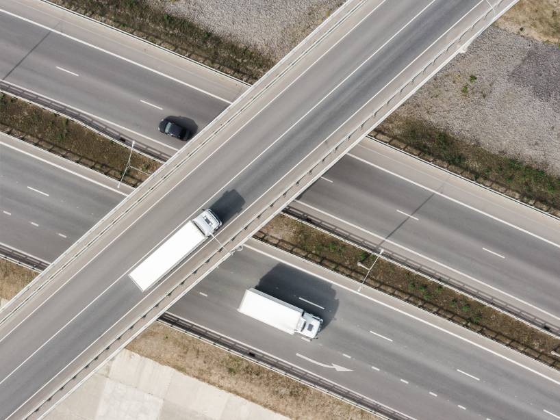 Two Trucks Driving Over Under Passway Bridge Route Planning