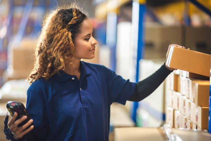 Woman Assess Current Inventory Carton Boxes Female Supply Chain Warehousing