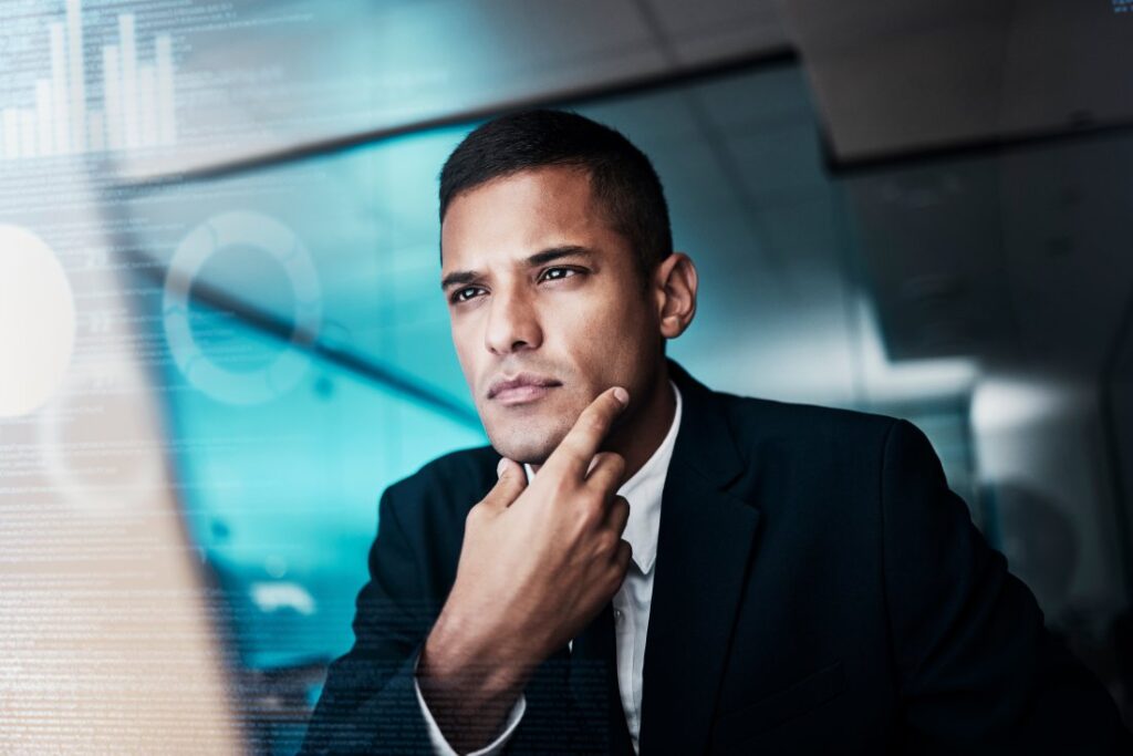 Man in front of computer. Digital transformation is needed by civic leaders of the future.