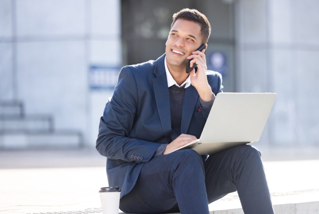 Man in front of laptop and in a call to build their network