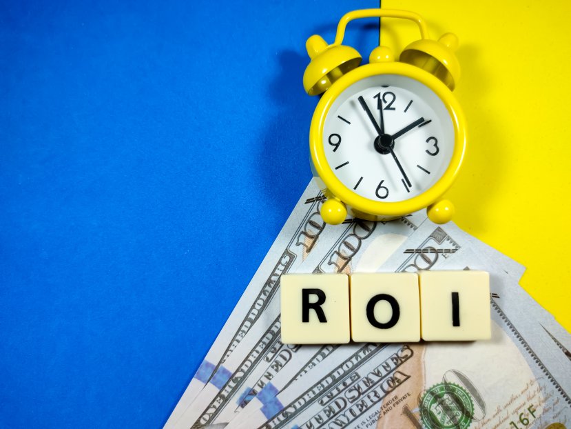 ROI Return On Investment Concept Alarm Clock Dollar Bills