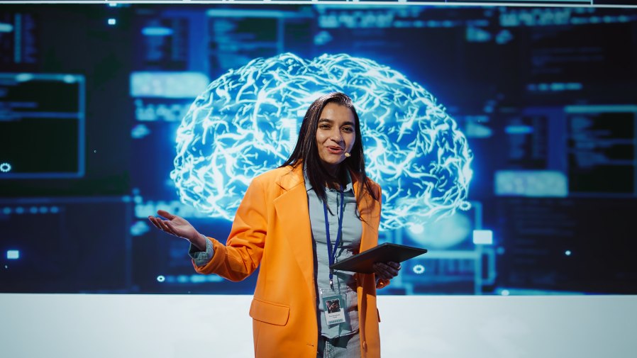 Speaker Female Presenter Promoting Tech Technology Ai Artificial Intelligence Brain Digital Screen