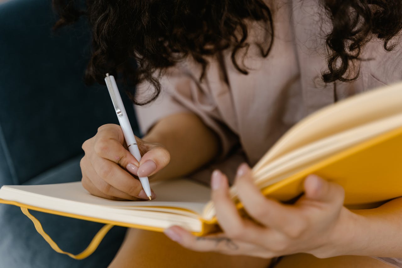 A woman writing on paper