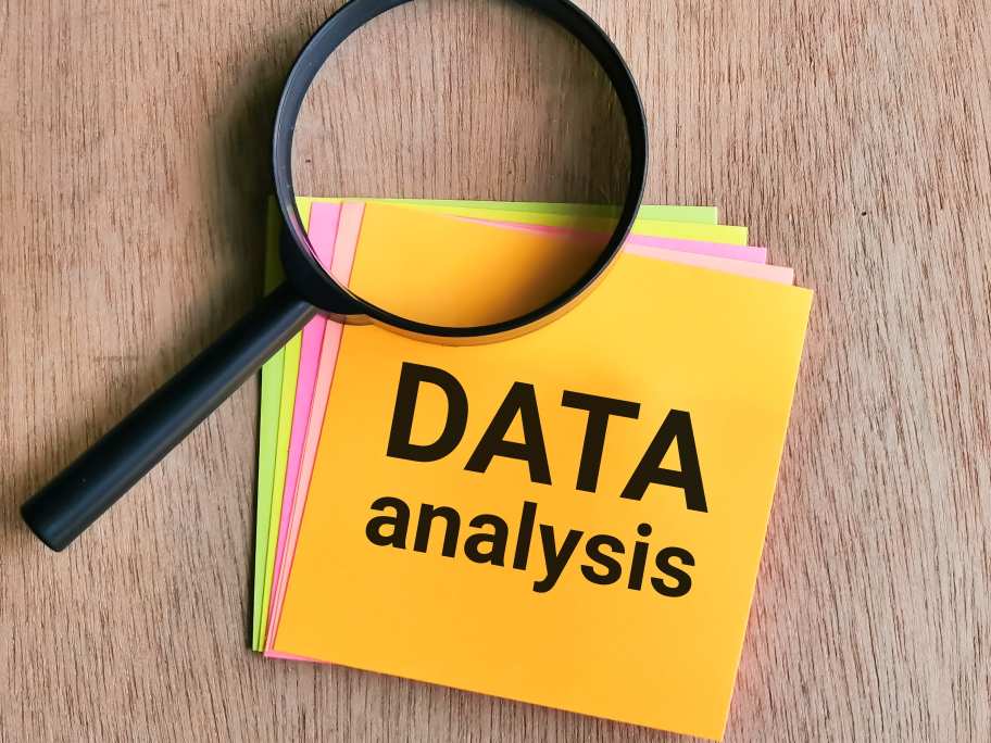 Phrase Data Analysis written on sticky note - analyzing data is one of the business intelligence exercises to master